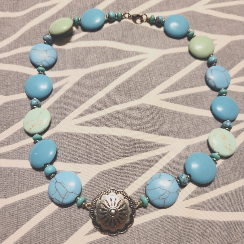 Faux turquoise and silver tone concho necklace